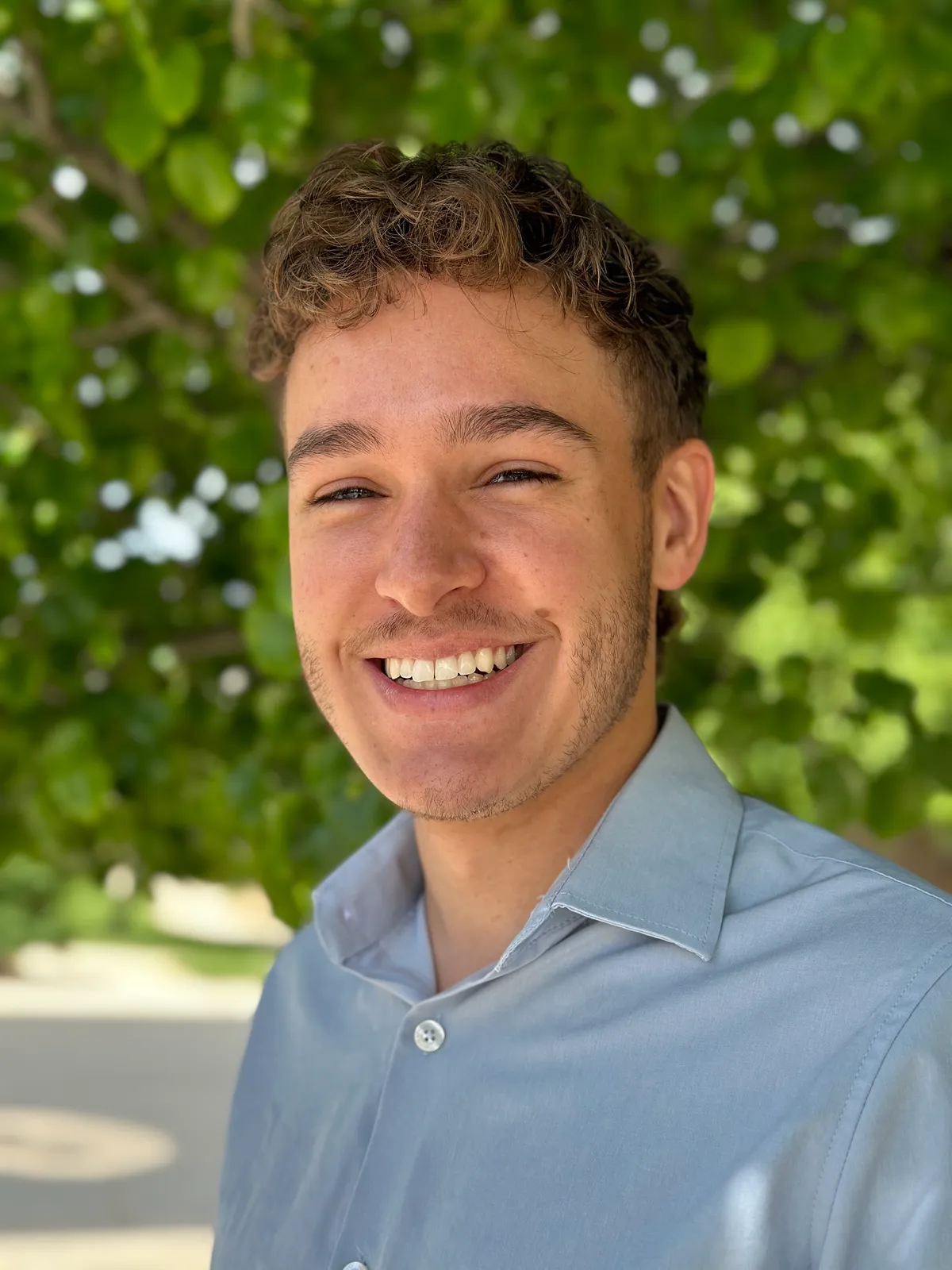 Professional headshot of Shadrac Reyes